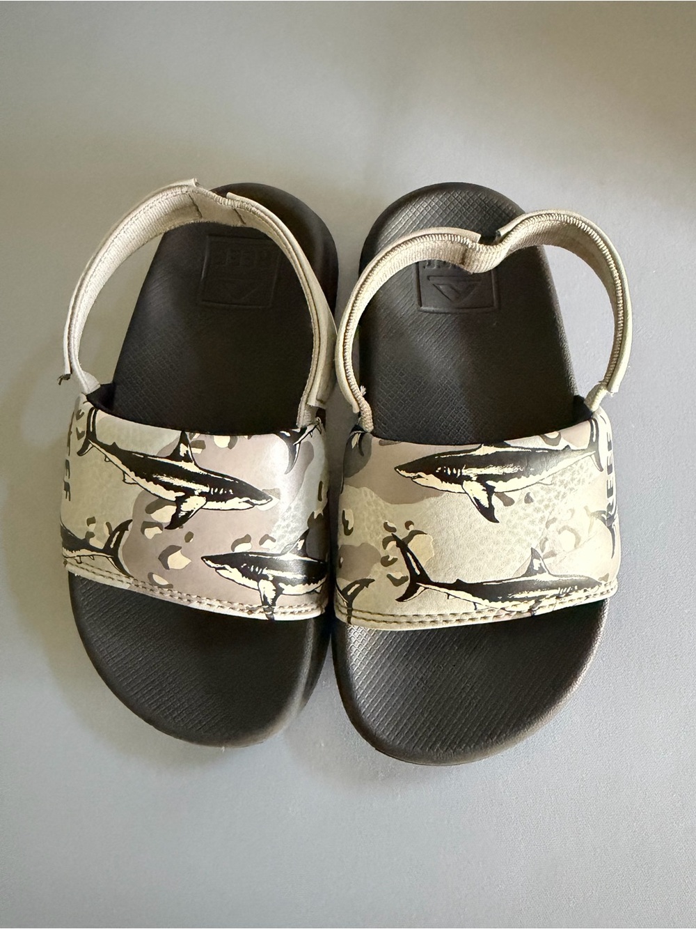 Reef Toddler Slide Sandals in Black and Beige